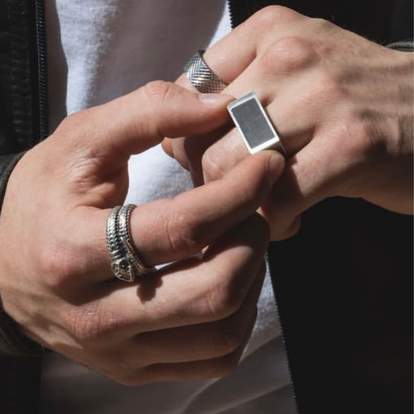 Silver and black ring